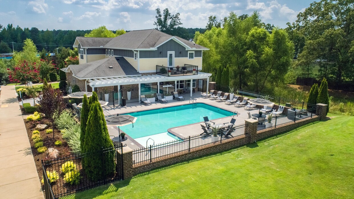 Revel in the beauty of our resort-style pool and expansive sundeck from an aerial perspective, showcasing the community's luxurious amenities and exquisitely manicured landscaping. - Rowan Park