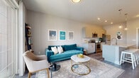 Located at 2865 Olentangy River Rd in Columbus, OH, this 1-bedroom, 1-bathroom unit offers a thoughtfully designed open-concept layout on a single floor. The combined kitchen and living area serves as the heart of the home, featuring wood-look flooring, recessed lighting, and large sliding glass doors that flood the space with natural light and open onto a private balcony with outdoor views.

The kitchen is outfitted with granite countertops, a spacious island with seating, white subway tile backsplash, gray cabinetry, and a full suite of stainless steel appliances including an electric range, microwave, and refrigerator. Pendant lighting above the island adds a stylish touch.

The living area is bright and airy, with floor-to-ceiling windows framing outdoor views and providing seamless access to the balcony. The bedroom features plush carpeting, a generational window for natural light, and direct access to a dedicated laundry area with in-unit washer and dryer.

The bathroom is elegantly finished with a granite-topped dual vanity, soft blue cabinetry, hardwood-style flooring, and a glass-enclosed walk-in shower with marble-style tile surround. A closet and utility room round out the functional layout of this efficiently designed Columbus residence.