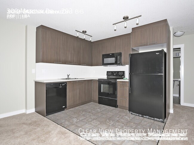 Photo du bâtiment - 2 Bedroom Chestermere Station Condos - 1 b...