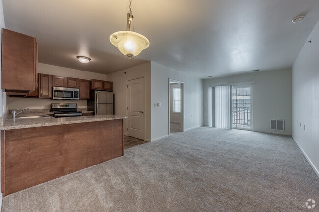 2BR, 1BA - 825SF - Living and Dining Area - Lafayette Square Senior Apartments