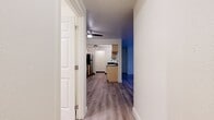This 760 square foot apartment in Lake Oswego, Oregon offers a well-designed living space with two bedrooms and two bathrooms. The single-story layout maximizes efficiency, with the primary bedroom spanning a comfortable 150 square feet.

Upon entering, you're greeted by an open-concept living area featuring a striking fireplace and sliding glass doors leading to a private balcony, seamlessly blending indoor and outdoor living. The modern kitchen boasts light wood cabinetry, contrasting dark countertops, and stainless steel appliances, creating a functional and aesthetically pleasing cooking space.

Both bedrooms offer ample space and natural light, with large windows overlooking the surrounding greenery. The bathrooms are tastefully appointed, one featuring a spacious vanity and the other a full bathtub-shower combination.

Throughout the apartment, newly installed wood-look flooring adds warmth and durability. The neutral color palette and abundance of natural light create a bright, airy atmosphere. Additional amenities include in-unit laundry facilities and a dedicated closet for storage.

This apartment combines comfort and practicality, ideal for those seeking a modern living space in a desirable Lake Oswego location.
