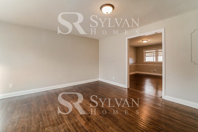 Building Photo - The living is easy in this 4 bedroom, 2 ba...