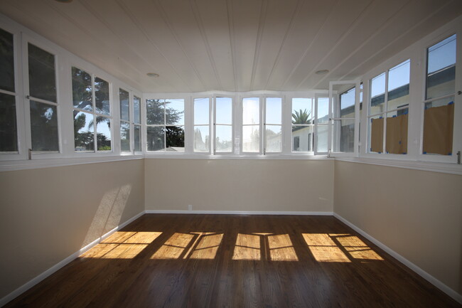 SUNROOM WITH NEW WINDOWS - 1003 Ashland Ave