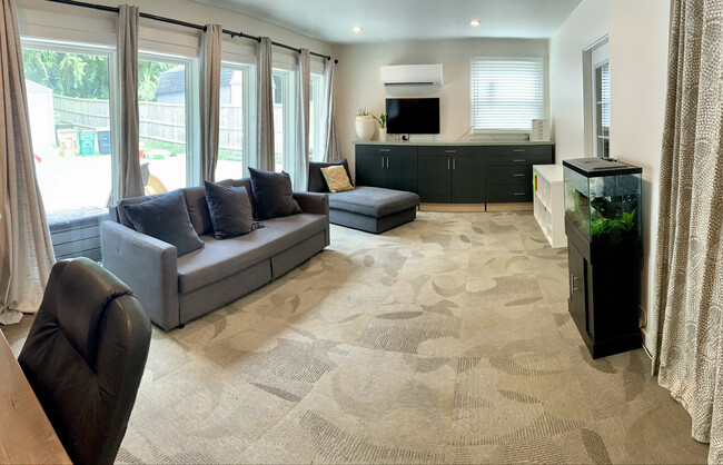 Bonus room featuring a wall of Pella windows - 604 Joyce Ln