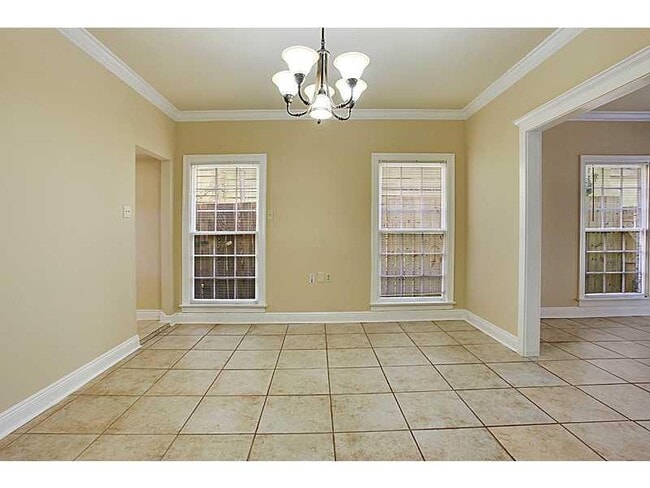 Dining room, looking east. One kitchen entrance on left - 95 Versailles Blvd