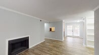 Located at 10027 Spice Ln in Houston, TX, this single-floor home offers a well-organized layout with a blend of comfort and functionality throughout. The living area is bright and open, finished with wood-look plank flooring, crown molding, and a classic fireplace as a focal point. Natural light flows in through multiple windows, and a set of glass patio doors leads to the outdoors, enhancing the airy feel of the space. A pass-through window connects the living area to the kitchen, adding a convenient and social element to the layout. A separate dining area adjacent to the kitchen provides additional space for everyday meals.

The galley-style kitchen is efficiently designed with white cabinetry, granite-look countertops, black appliances, and a double sink. A dedicated pantry or storage closet is accessible directly from the kitchen. The bedrooms are carpeted for comfort and include ceiling fans, ample natural light from exterior windows, and generous closet space, with at least one bedroom featuring a walk-in closet.

The bathrooms are clean and functional, featuring white vanity cabinetry with granite-look countertops, a tub-shower combination, and wood-look flooring. The overall color palette throughout the home is neutral and light, creating a calm, move-in-ready environment.