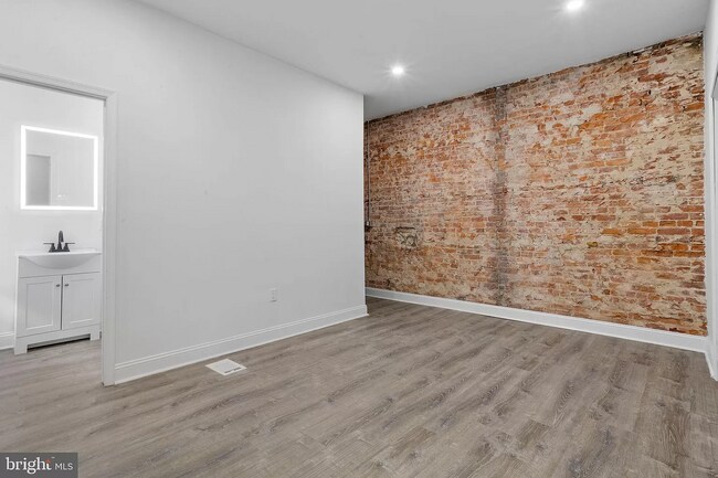 Large Spacious Master Bedroom with Exposed Brick Wall - 1625 S 22nd St