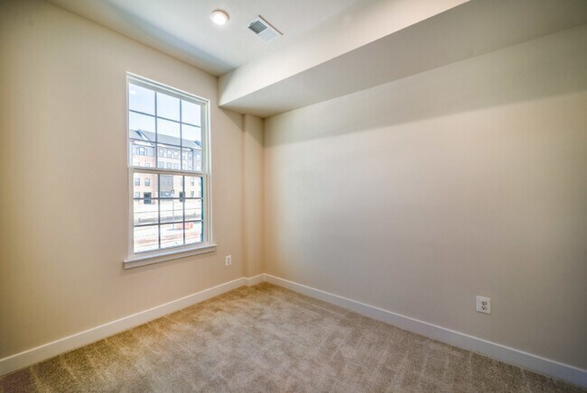 Building Photo - This 3-bedroom, 3-full bathroom townhouse offers a pristine and contemporary living experience.