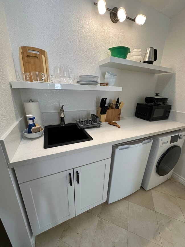 In-unit washer and dryer. - 20810 E Crest Ln