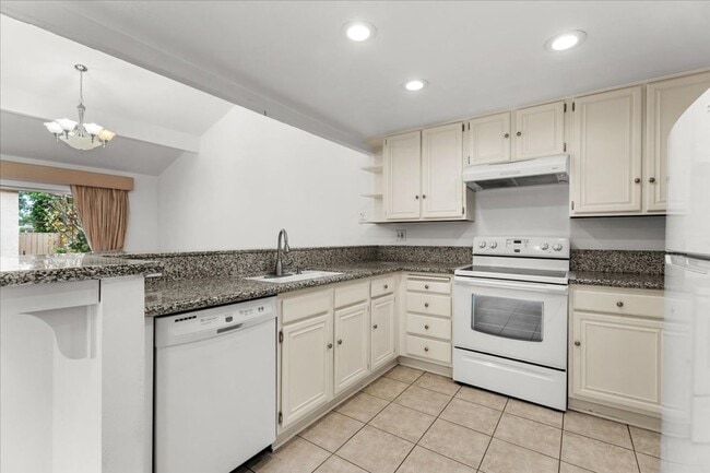 Building Photo - Private Street-Access Condo with Garage, Courtyard, Pool and Tennis