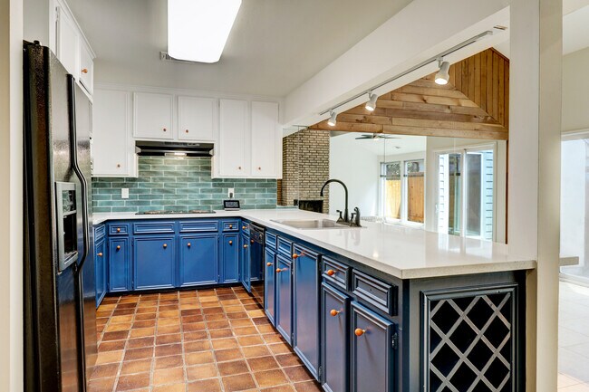 The kitchen opens to the living and dining, making entertaining a breeze. - 107 Phanturn Ln
