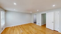 Located at 18 Max Dr in Morristown, NJ, this one-bedroom, one-bathroom unit offers a thoughtfully designed single-floor layout with a clean, modern aesthetic throughout. Warm hardwood flooring flows seamlessly through the living room, bedroom, and connecting spaces, lending the home a cohesive and inviting feel.

The living room is bright and open, featuring recessed lighting, soft neutral walls, and multiple windows fitted with blinds that allow for natural light control. The space is well-proportioned, providing comfortable room for both relaxing and entertaining.

The kitchen is efficiently designed and fully equipped with rich cherry wood cabinetry, light stone countertops, and a full suite of stainless steel appliances including a refrigerator, range, microwave, and dishwasher. Wood-look flooring adds a practical yet stylish touch to this culinary space.

The generously sized bedroom features two windows overlooking lush greenery, filling the room with natural light and a calming outdoor view. Recessed and overhead lighting options add versatility to the space.

The bathroom is clean and functional, featuring a vanity with warm wood cabinetry, white countertop, and a full bathtub and shower combination with chrome fixtures, all complemented by wood-look flooring. The overall ambiance of this unit is fresh, modern, and move-in ready.