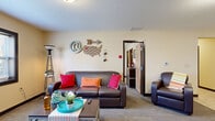 Located at 1482 N Lexington Springmill Rd in Mansfield, Ohio, this single-floor residence offers a practical and comfortable layout across three bedrooms and three bathrooms. Warm, neutral-toned walls and carpeted flooring flow throughout the living spaces, creating a cohesive and welcoming ambiance.

The living room is a bright, open gathering space featuring a large window that allows natural light to fill the room, complemented by patterned carpet flooring. The kitchen is efficiently designed with light wood cabinetry, dark countertops, tile flooring, and white appliances including a refrigerator, dishwasher, and range — with space to accommodate a dining table.

Each of the three bedrooms is a comfortable, private retreat with carpeted floors, a window for natural light, and room for a bed and additional furnishings. The primary bedroom offers generous space relative to the other rooms. All three bathrooms are consistently appointed with white vanity cabinetry, countertops, and mirrors; two feature shower-tub combos with curtains, while one is a more compact configuration. A dedicated utility room and hallway with closets provide practical storage solutions, rounding out this well-organized and functional residence.
