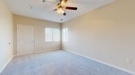 Located at 3540 N Maize Rd in Wichita, Kansas, this thoughtfully designed 2-bedroom, 2-bathroom residence offers a comfortable and functional layout across a single floor. The entrance welcomes you into a bright living area featuring warm wood-look flooring and a sliding glass door framed by vertical blinds that floods the space with natural light. The combined dining room and kitchen is a standout feature, showcasing dark espresso cabinetry, a tile mosaic backsplash, black appliances including a refrigerator, range, and microwave, along with dark granite-style countertops — all complemented by warm hardwood-style flooring. Both bathrooms echo this refined aesthetic with matching dark vanity cabinetry, granite-style countertops, and full tub-shower combinations set on wood-look flooring. The two bedrooms are carpeted for comfort, each featuring ceiling fans with light fixtures and natural light from windows with white blinds. The primary bedroom is generously sized and benefits from a walk-in closet with multi-tier wire shelving. A second bedroom offers a double-door closet. Three closets in total provide ample storage throughout. A dedicated laundry room, a carpeted staircase with a handrail, and a welcoming entrance complete this well-rounded residence.