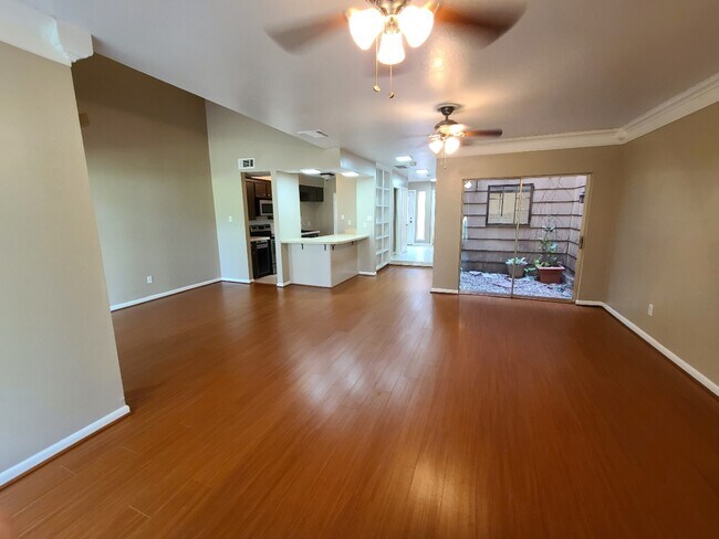 Large and bright living space with beautiful atrium view - 8003 Rebawood Dr