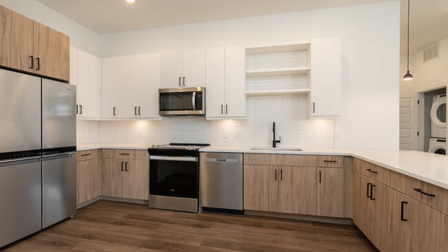 Kitchen with stainless steel appliances and hard surface flooring - Lyle