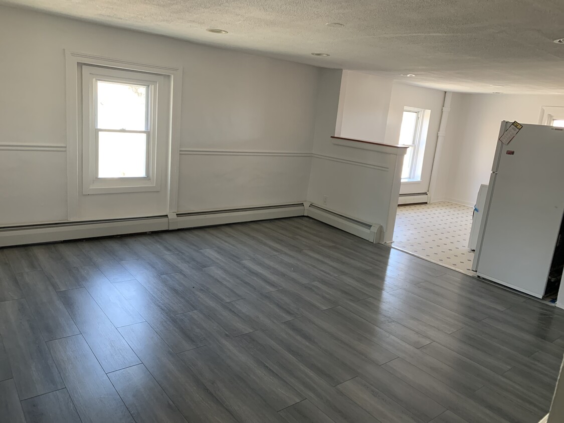 main living room with transition to kitchen - 1 N Franklin St