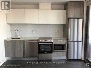 Building Photo - 50A-1550 Charles St E