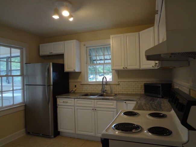 Building Photo - Charming 2-Bedroom, 2-Bath Single-Family Home with Sunroom & Wooded Views