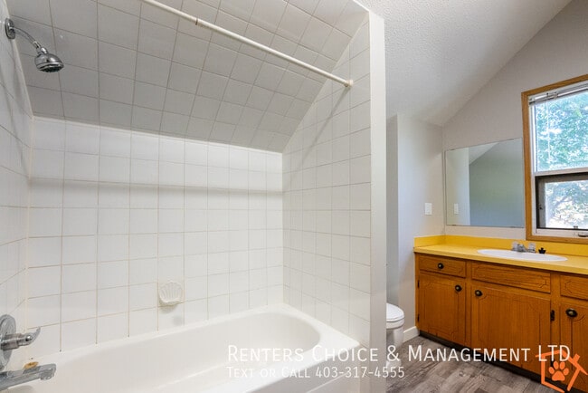 Building Photo - MAIN FLOOR UNIT With Assigned Parking and Onsite Laundry