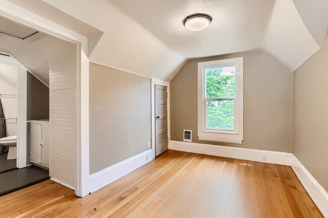 Living room, with storage closet. - 4130 SE Cesar E Chavez Blvd