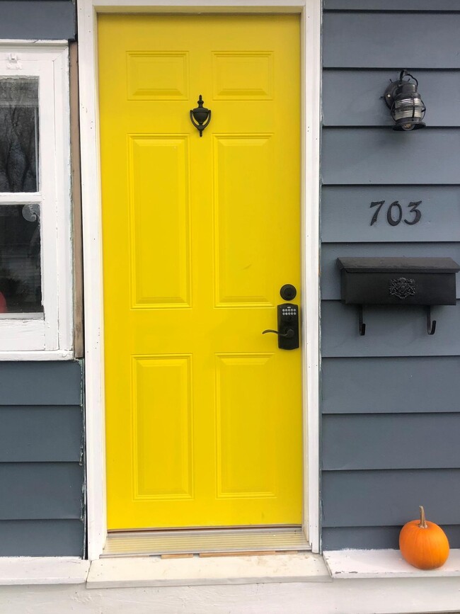 New yellow front door w/ push button locks! - 703 S Fifth St