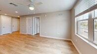 This contemporary 560 square foot apartment offers a thoughtful blend of style and functionality. The open-concept design seamlessly integrates the kitchen, living, and dining areas, creating a spacious feel despite its compact footprint. The kitchen is a highlight, boasting crisp white cabinetry, granite countertops, and a full suite of stainless steel appliances, including a refrigerator, dishwasher, and range.

The 120 square foot bedroom provides ample space and features a large window that allows natural light to flood the room. A ceiling fan adds both style and comfort. The bathroom showcases a modern vanity with a granite countertop, complemented by a well-lit mirror and a combination tub/shower.

Throughout the apartment, warm wood-look flooring adds a touch of elegance and ties the spaces together. The neutral color palette on the walls provides a blank canvas for personal decor. Practical amenities include in-unit laundry and a closet for storage.

Large windows in the living area and bedroom offer views of the surroundings and fill the space with natural light. The apartment's single-floor layout ensures easy accessibility. Located at 4464 N Tamiami Trl, 204, this property combines modern comforts with a convenient address, making it an ideal choice for those seeking a stylish, low-maintenance living space.