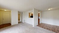 Located at 102 Sable Chase Blvd in McDonough, GA, this single-floor, 3-bedroom, 2-bathroom home offers a practical and comfortable layout. The open living area features neutral carpet flooring and connects seamlessly to the kitchen via a pass-through window, creating an airy, connected feel. The galley-style kitchen is equipped with warm wood cabinetry, black appliances including a refrigerator and range, and hard surface flooring that extends throughout the main areas. Textured ceilings and flush-mount lighting are consistent throughout the home. The three bedrooms are carpeted and offer a calm, neutral palette; the primary bedroom is generously sized with access to a closet and features both a window and a sliding door for natural light. The two full bathrooms include tub/shower combos with white tile surrounds, wood-toned vanity cabinetry, and hard surface flooring. A dedicated laundry room houses a full-size front-loading washer and dryer set with overhead wire shelving for additional storage. Two closets provide organized storage throughout the home. The overall design is clean and functional, with a consistent neutral color scheme that lends itself well to personalization.