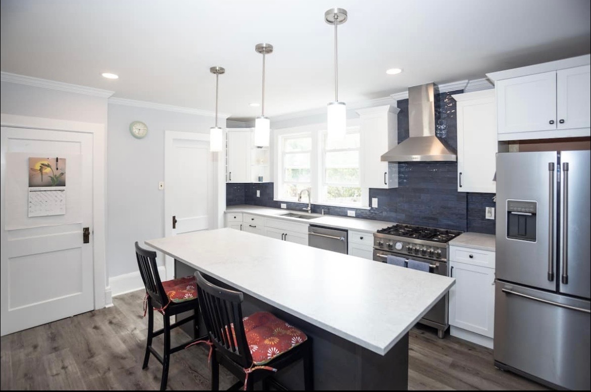 Newly renovated kitchen with open floor plan into dining room. - 181 Mills St