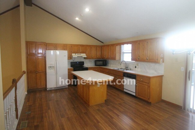 Building Photo - Wood floors finished  basement fenced yard