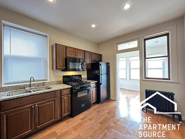 Foto del edificio - 5023 N Ridgeway Ave