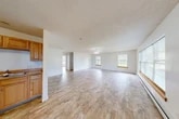 Located at 115 Raymond St in Montour Falls, NY, this single-floor home offers a practical and comfortable layout with four bedrooms, one bathroom, a kitchen, living room, entrance, and closet. The open-concept living area is generously sized, featuring light tile-style flooring, a textured ceiling, and a ceiling fan with integrated lighting. Multiple windows dressed with blinds and warm wood sills flood the space with natural light and offer views of the surrounding greenery. Baseboard heating runs throughout the home, ensuring consistent warmth. The kitchen is equipped with solid wood cabinetry in a honey oak finish, laminate countertops, a coil-burner range, and a double-basin sink, all set on matching tile-style flooring. Each of the four bedrooms is a well-proportioned, bright room with large windows and the same consistent flooring found throughout the home. The primary bedroom offers a comfortable footprint with ample natural light. The bathroom features a full tub-shower combo, an oak vanity with a dark countertop, a wall mirror, and tile flooring. The overall ambiance of the home is clean, bright, and move-in ready, with a neutral color palette that lends itself to easy personalization.