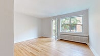 Located on Avenue Decelles in the Côte-des-Neiges neighbourhood of Montréal, this well-maintained 2-bedroom, 1-bathroom unit offers a functional and comfortable single-floor layout. Light hardwood flooring runs consistently throughout the space, creating a warm and cohesive aesthetic across every room.

The living area is bright and airy, benefiting from a glass-panelled exterior door that invites natural light and provides access to the outdoors. The kitchen is thoughtfully updated, featuring white shaker-style cabinetry, dark countertops, and a striking mosaic tile backsplash in tones of blue, grey, and white. White appliances, including a range and built-in microwave, complement the clean design. A dishwasher and tall pantry cabinet add practical storage solutions.

The primary bedroom is generously sized, offering a bright window with views of the surrounding neighbourhood and a radiator heating unit. The second bedroom is well-proportioned and similarly finished with hardwood floors and neutral walls. Both rooms provide a calm, versatile space.

The bathroom is cleanly renovated with white subway-style wall tiles, grey floor tiles, a modern floating vanity with a mirrored medicine cabinet, a soaking tub, and a window for ventilation. A hallway connects the rooms, contributing to an efficient and organized floor plan throughout.