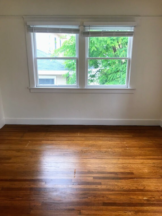 Building Photo - Beautiful 1 Bedroom with Vintage Floors an...