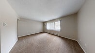 Located at 2704 Westmar Ct in Toledo, Ohio, this one-bedroom, one-bathroom unit delivers a functional and well-organized single-floor layout. The living room is a generously sized, carpet-floored space featuring large windows with vertical blinds that invite natural light, a wall-mounted air conditioning unit, and baseboard heating — creating a comfortable environment year-round. A ceiling fan adds additional airflow to the area adjacent to the kitchen.

The kitchen is efficiently designed with dark cabinetry providing ample upper and lower storage, light countertops, a stainless steel sink, and white appliances including a refrigerator and electric range. Wood-look vinyl flooring runs throughout the kitchen, adding a warm, durable finish.

The bedroom is a well-proportioned, carpet-floored room featuring a large window with natural views, baseboard heating, and a full-width louvered bi-fold closet. Two additional closets elsewhere in the unit provide generous storage throughout. A textured ceiling is consistent across the main living spaces.

The bathroom is clean and functional, featuring a tub/shower combination with a curved curtain rod, a vanity with storage, and wood-look vinyl flooring that coordinates with the kitchen. Baseboard heating keeps the space comfortable in cooler months.