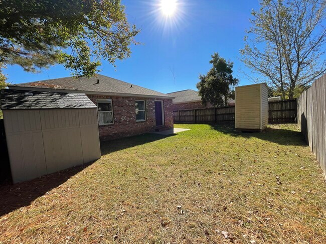 Backyard with 2 storage sheds - 9 Findlay St