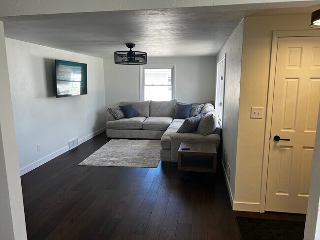 Living room with a 58" flatscreen - 1418 Oak Ridge Dr