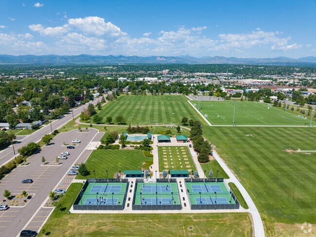 Englewood residents play pickleball at Belleview-Cornerstone Park or picnic in the spacious green fields.