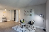 Located at 1607 Parkmoor Ave in San Jose, CA, this one-bedroom, two-bathroom residence offers a thoughtfully designed single-level layout with modern finishes throughout. Wood-look flooring flows consistently across the living areas, lending a clean and cohesive aesthetic.

The living room is generously sized, featuring a textured ceiling, a bold teal accent wall, and a sliding glass door that opens onto a private balcony, inviting natural light and outdoor views into the space. The welcoming entrance area features a ceiling fan and connects seamlessly to the main living zone.

The kitchen is outfitted with contemporary two-tone cabinetry — white uppers and warm wood-toned lowers — paired with sleek quartz countertops and a geometric tile backsplash, creating a stylish and functional cooking space.

The bedroom is a comfortable retreat with neutral tones, wood-look flooring, and access to a well-appointed walk-in closet featuring dual hanging rods and built-in shelving for ample storage.

Two bathrooms serve the residence: one includes a modern vanity with a wood-grain cabinet and white quartz countertop, while the second features a full soaking tub and shower combo. The overall ambiance is bright, clean, and move-in ready.