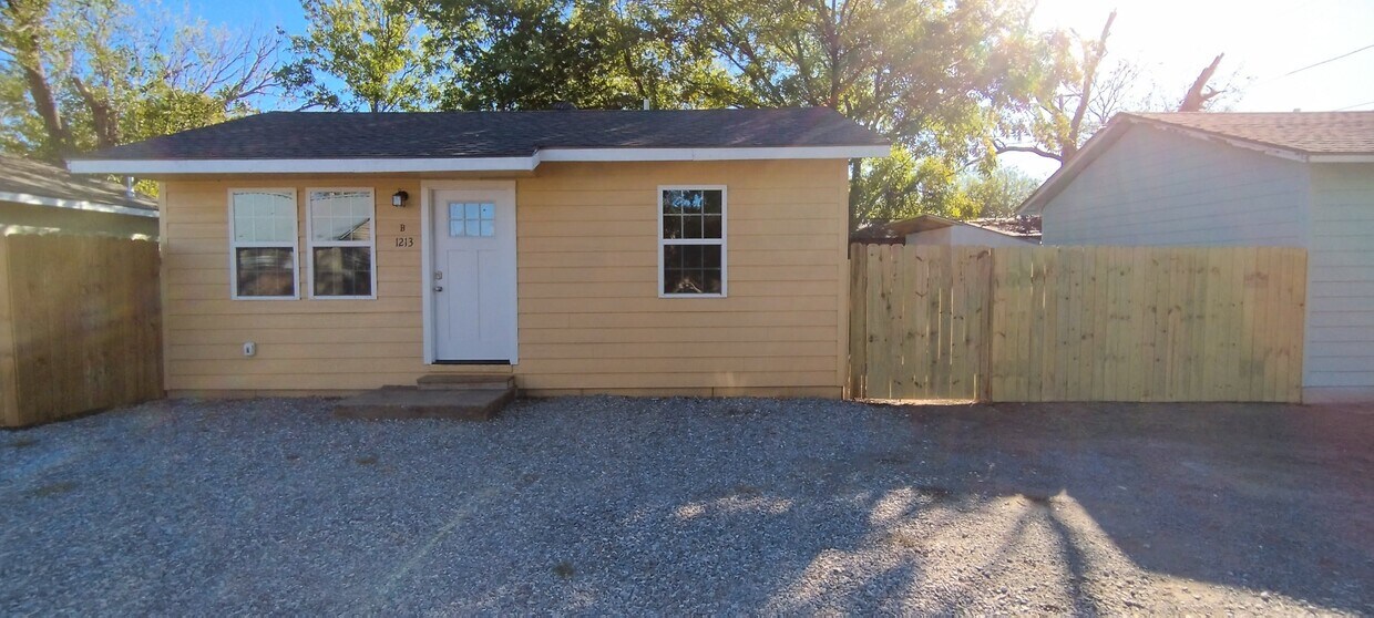 front of house with gate to the right for backyard - 1213 N 3rd St