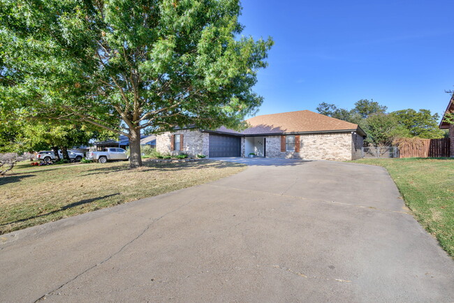 Single story home with a front yard and oversized driveway with room for up to 3 additional vehicles - 209 Prairie Wind Blvd