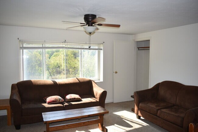Living room looks over parking lot - 438 Stewart St