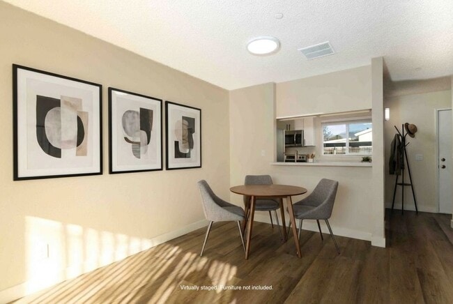 2 BR, 1.5BA Townhouse Dining Area (staged) - Mission Village Apartments