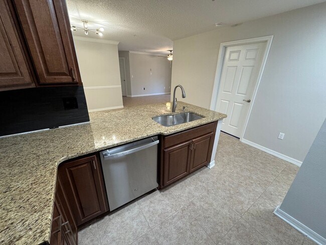 Building Photo - Oviedo 2/2 Condo with Tile & LVP Flooring, Updated Baths, New Paint & Appliances!