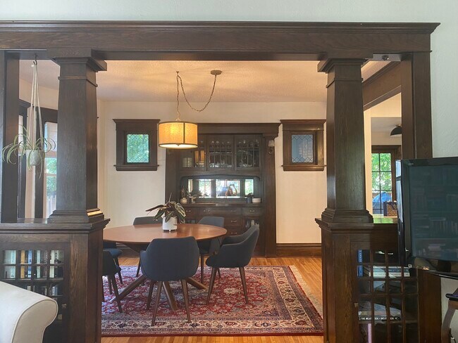 Dining room with 6 person table and built in storage - 3224 38th Ave S