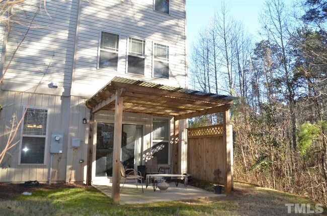 private back porch overlooks trees and creek - 2924 New Hill Park Rd