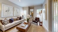 Located at 3333 Hacks Cross Rd in Memphis, Tennessee, this single-floor residence offers a thoughtfully designed layout with a cohesive, neutral color palette that creates a calm and welcoming atmosphere throughout. The living room is a comfortable, light-filled space featuring plush carpet, crown molding, recessed lighting, and large windows that invite natural light. A separate dining area with floor-to-ceiling vertical blinds opens to an outdoor view, anchored by an elegant pendant light and crown molding details. The kitchen is well-equipped with rich dark wood cabinetry, granite-style countertops, hardwood flooring, and black appliances including a range, over-the-range microwave, and refrigerator. Multiple bedrooms offer carpeted floors, ceiling fans, and ample natural light from generously sized windows, each providing a restful and comfortable retreat. The bathrooms are finished with dark wood vanities, granite-style countertops, and hardwood flooring. One bathroom features a glass-enclosed walk-in shower, while another includes a tiled soaking tub with classic white and green tile accents. Together, these spaces combine functional design with refined finishes, creating a cohesive and comfortable living environment.