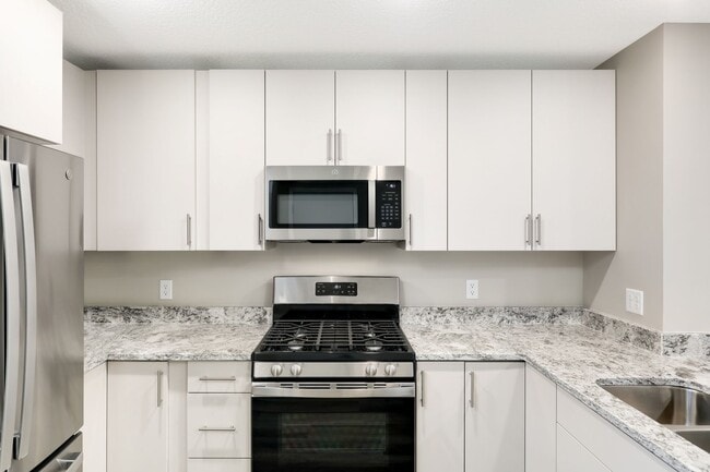 Building Photo - Enjoy where you rent! 3bd 3ba 2car garage townhome available now