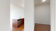 Located on a high floor at 320 Tweedsmuir Ave in Toronto's Forest Hill neighbourhood, this one-bedroom, one-bathroom unit offers a well-designed layout across a single level. Warm hardwood flooring flows throughout, complementing the clean, contemporary aesthetic of the space.

The open-concept kitchen and living area forms the heart of the unit. The kitchen is outfitted with rich walnut-toned cabinetry, a light quartz countertop peninsula with an undermount sink, stainless steel appliances including a range and refrigerator, and a tiled backsplash — all illuminated by track lighting overhead. The peninsula doubles as a breakfast bar, connecting the kitchen seamlessly to the living area.

The living room is bright and airy, anchored by expansive floor-to-ceiling windows that frame sweeping views of the Toronto skyline and the lush tree canopy below, flooding the space with natural light.

The bedroom is a comfortable, well-proportioned retreat, also benefiting from large windows with city and greenery views. It features a full-width mirrored sliding closet, enhancing the sense of space.

The bathroom is finished with white wall tiles accented by a warm earth-toned tile border, a soaker tub with overhead shower, and tile flooring. Two hallways provide efficient circulation and additional storage potential throughout the unit.
