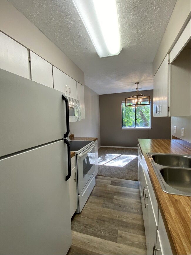 Refrigerator, electric stove and microwave. - 3027 W Capital Ave